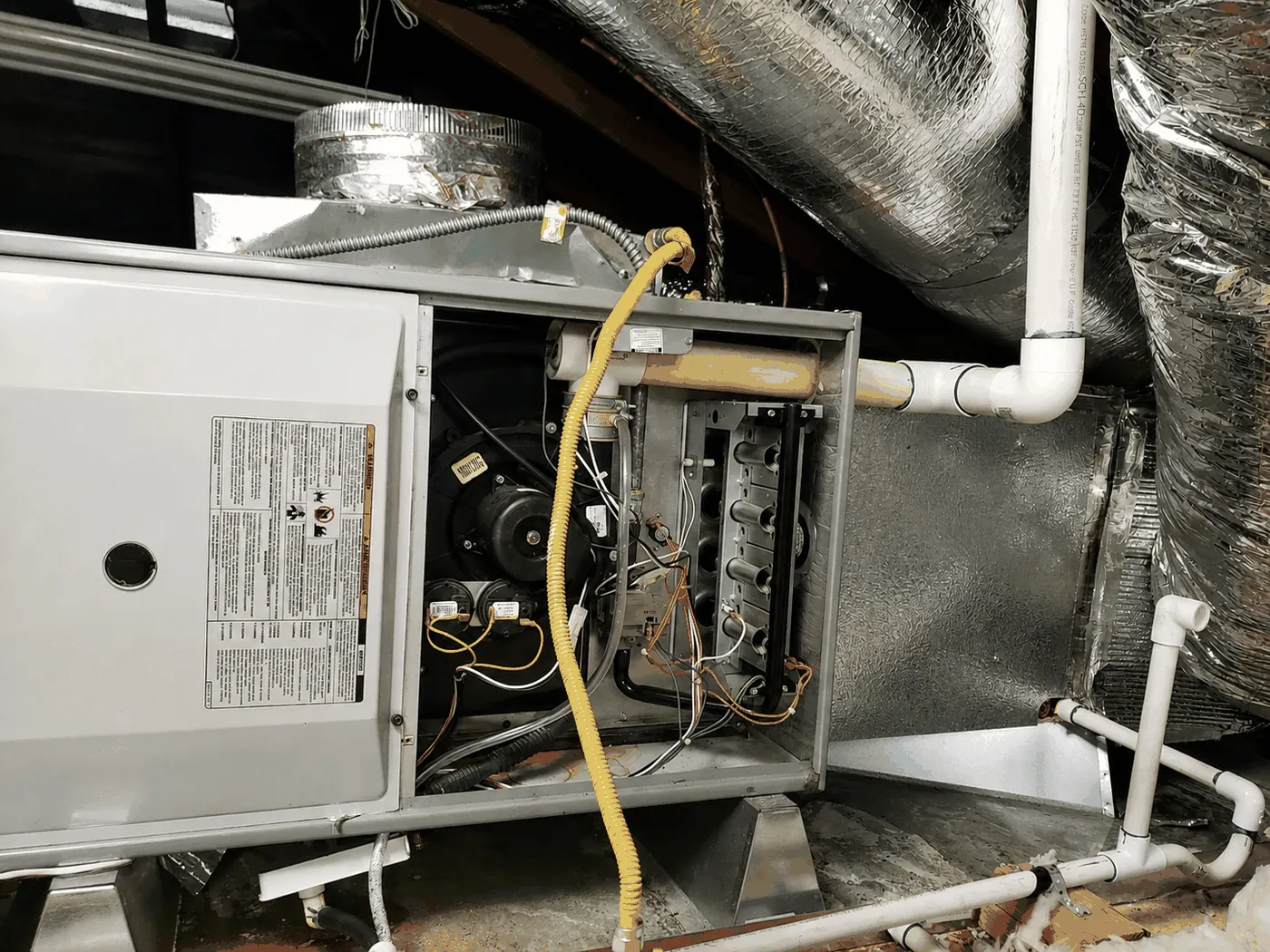 Bay Area furnace with access panel removed during a repair diagnostic.