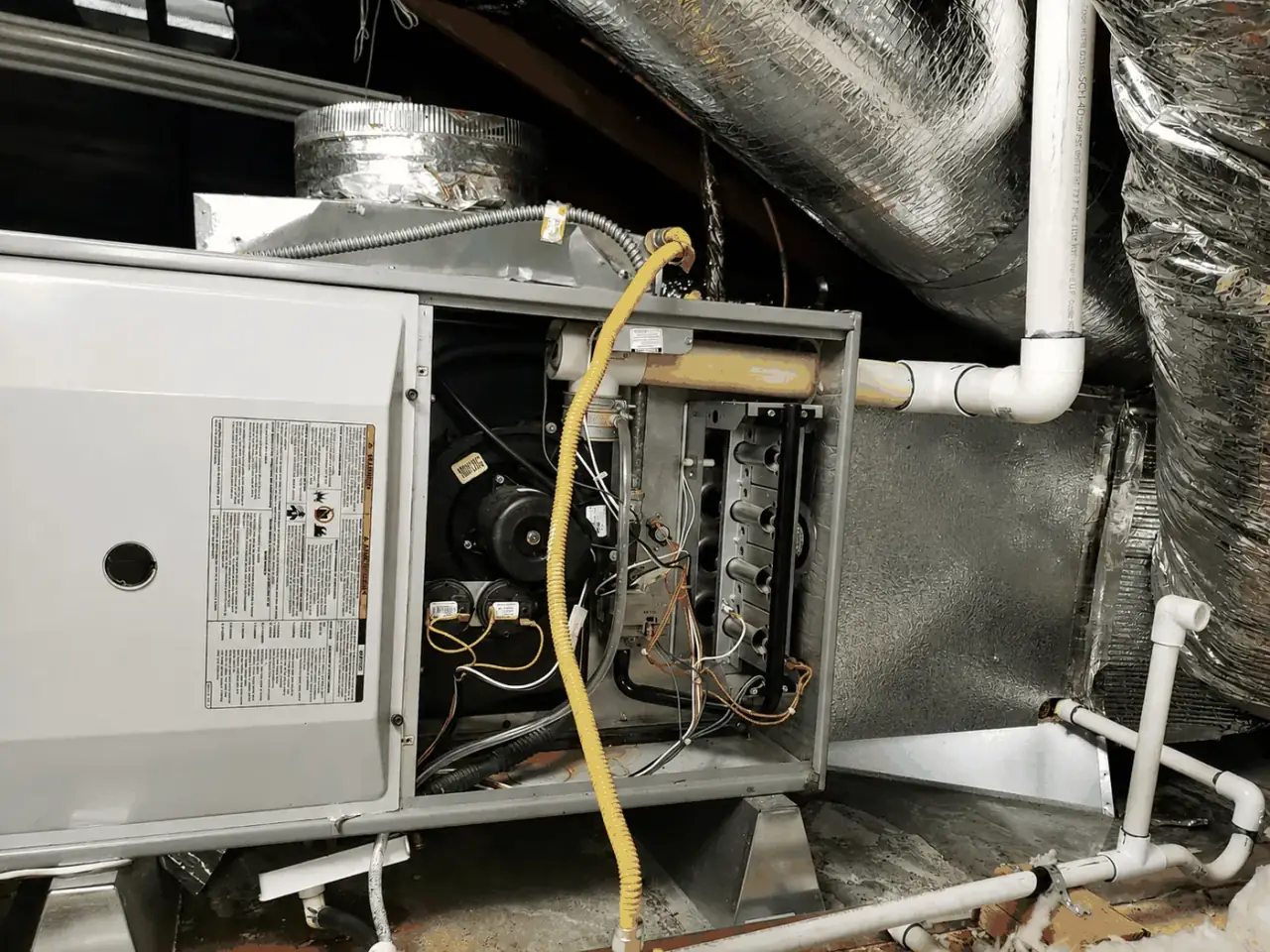 Bay Area furnace with access panel removed during a repair diagnostic.