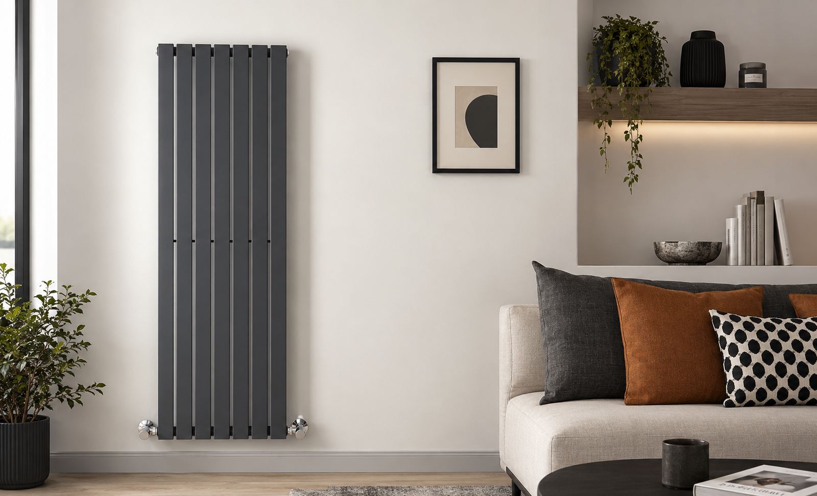 Modern anthracite vertical panel radiator mounted in a contemporary living room with chrome thermostatic valves.